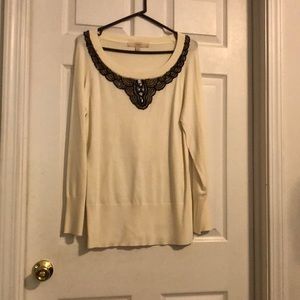 Embellished sweater.